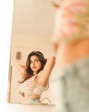 Sultry Iswarya Menon in a Denim Short and Butterfly Crop Top Pictures 01