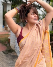 Telugu Actress Anasuya Bharadwaj in a Light Brown Saree with a Dark Brown Sleeveless Blouse Pictures 04