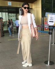 Trendsetting Mouni Roy at the Airport Photos 03