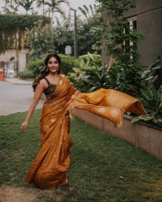 Attractive Nabha Natesh in a Mustard Yellow Saree Photoshoot Pictures 04