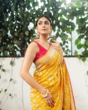 Beaming Beauty Mrunal Thakur in a Yellow Silk Saree with Sleeveless Pink Blouse Photos 01