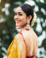 Beaming Beauty Mrunal Thakur in a Yellow Silk Saree with Sleeveless Pink Blouse Photos 03