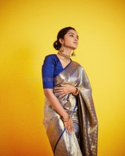 Curly Beauty Anupama Parameswaran in a Blue and Silver Silk Saree with a Blue Blouse Photos 05