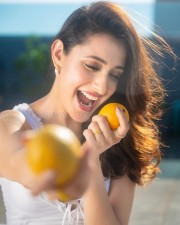 Cute Pragya Jaiswal eating Mangoes in a White Crop Top Photos 04