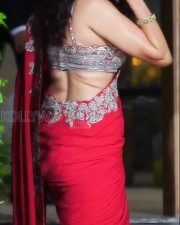 Dazzling Pragya Jaiswal in a Red Printed Saree with a Shoulder Strap Embroidered Blouse Photos 01