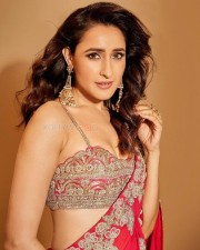 Dazzling Pragya Jaiswal in a Red Printed Saree with a Shoulder Strap Embroidered Blouse Photos 03