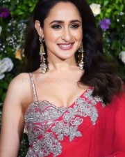 Dazzling Pragya Jaiswal in a Red Printed Saree with a Shoulder Strap Embroidered Blouse Photos 09