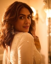 Elegant Mrunal Thakur in a Traditional Cream White Anarkali Suit Photos 02