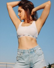 Impressive Pragya Jaiswal in a White Bralette and Ripped Denim Shorts Pictures 01