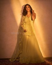 Mesmerizing Bollywood Actress Mrunal Thakur in a Yellow Embroidered Sharara Photos 05