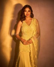 Mesmerizing Bollywood Actress Mrunal Thakur in a Yellow Embroidered Sharara Photos 07