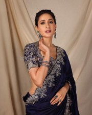 Pretty Actress Pragya Jaiswal in an Embroidered Navy Blue Saree Photos 01