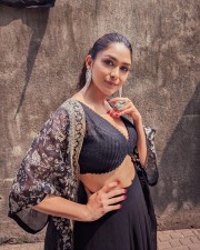 Sexy Mrunal Thakur in a Black Lehenga with Deep Neck Blouse Photos 03