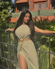 Stylish and Sexy Rashi Singh in a Light Green Sleevless Cutout Buckle Midi Dress Photos 01