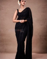 Tillu Square Heroine Anupama Parameswaran in a Black Shimmery Saree with Sleeveless Blouse Pictures 01