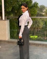 Aamna Sharif in a White Formal Shirt with Grey Trouser and Black Tie Photos 01