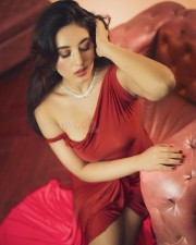 Pretty Hot Aditi Budhathoki in an One Shoulder Red Gown Photos 01