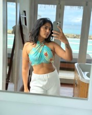 Stylish Eesha Rebba in a Teal Top with a White Pant Photos 04