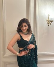 Dazzling Beauty Mehreen Pirzada in an Emerald Green Netted Saree with Sleeveless Blouse Photos 03