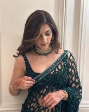 Dazzling Beauty Mehreen Pirzada in an Emerald Green Netted Saree with Sleeveless Blouse Photos 04