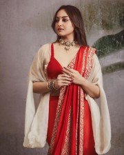 Mesmerising Sonakshi Sinha in a Red Saree with a Bralette Blouse and Beige Shrug Photos 03