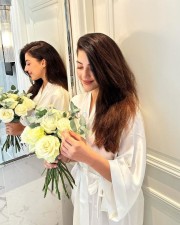 Nee Sigoovaregu Actress Mehreen Pirzada in a White Bathrobe Photos 04