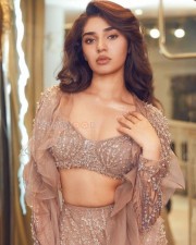 Dazzling Krithi Shetty in an Embroidered Nude Lehenga Photos 03