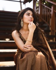 Elegant Krithi Shetty in a Sexy Brown Saree Photos 08