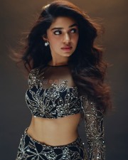 Glam and Gorgeous Krithi Shetty in a Silver and Black Daring Crop Top and Thigh Slit Skirt Photos 03
