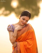 Gorgeous Janani Iyer in an Orange Silk Saree Photos 02