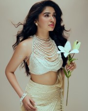 Gorgeous Tollywood Actress Krithi Shetty in an Pearl adorned Stylish Crop Top with a Designer Lehenga Photos 04
