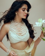 Gorgeous Tollywood Actress Krithi Shetty in an Pearl adorned Stylish Crop Top with a Designer Lehenga Photos 05