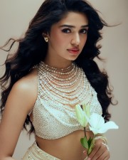 Gorgeous Tollywood Actress Krithi Shetty in an Pearl adorned Stylish Crop Top with a Designer Lehenga Photos 06