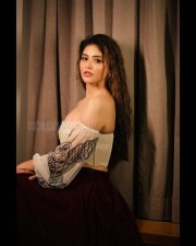 Sensuous Priyanka Jawalkar in a White Off Shoulder Top and Black Skirt Pictures 09