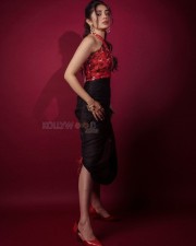 Telugu Actress Krithi Shetty in a Red Cutout Halter Neck Top and Black Skirt Pictures 04