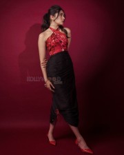 Telugu Actress Krithi Shetty in a Red Cutout Halter Neck Top and Black Skirt Pictures 07
