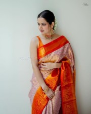 Traditional Beauty Ashika Ranganath in an Orange Silk Saree Pictures 06