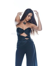 Punjabi Actress Sonam Bajwa in a Black Off Shoulder Top with a Bell Bottom Styled Pant Photos 02