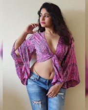 Enchanting Poonam Bajwa in a Knotted Pink Top with Torn Jeans Photos 05