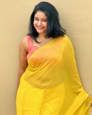 Mesmerizing Poonam Bajwa in a Yellow Saree with Sleeveless Orange Blouse Photos 02