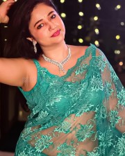 Sexy Poonam Bajwa in a See Through Turquoise Saree with Sleeveless Blouse Photos 03