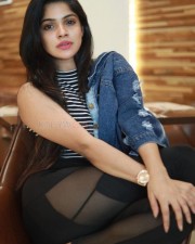 Sexy Divya Bharathi in a Black Mesh Leggings with Denim Jacket Photos 01