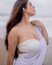 Bold Neha Malik in a White Saree with Sleeveless Blouse on the Beach Photos 02