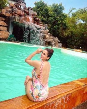 Sexy Eshanya Maheshwari in an One Piece Swimsuit Pool Photos 03