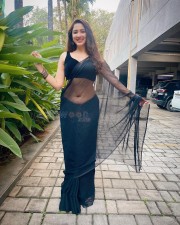 Sexy Esshanya Maheshwari Navel in a Transparent Black Saree with Sleeveless Blouse Photos 02