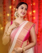 Stunning Eshanya Maheshwari in a White and Pink Saree with a Sleeveless Pink Blouse Photos 01