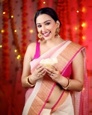 Stunning Eshanya Maheshwari in a White and Pink Saree with a Sleeveless Pink Blouse Photos 05