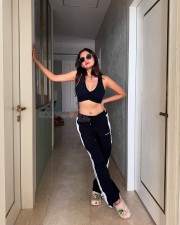 Curvaceous Anushka Sen in a Black Sporty Sleeveless Crop Top with Matching Bottom Track Pant Photos 02