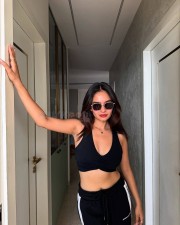 Curvaceous Anushka Sen in a Black Sporty Sleeveless Crop Top with Matching Bottom Track Pant Photos 05