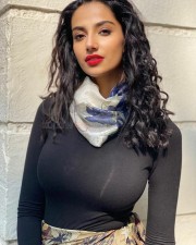 Khiladi Heroine Meenakshi Chaudhary Big Boobs in a Black Full Sleeve Top with Scarf Photo 01